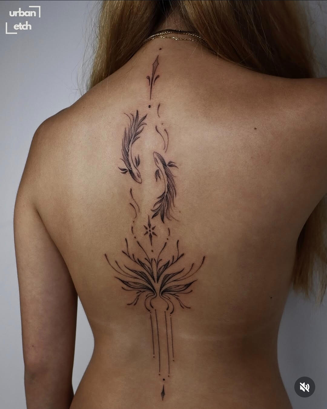 Large scale back ornamental tattoo feminine